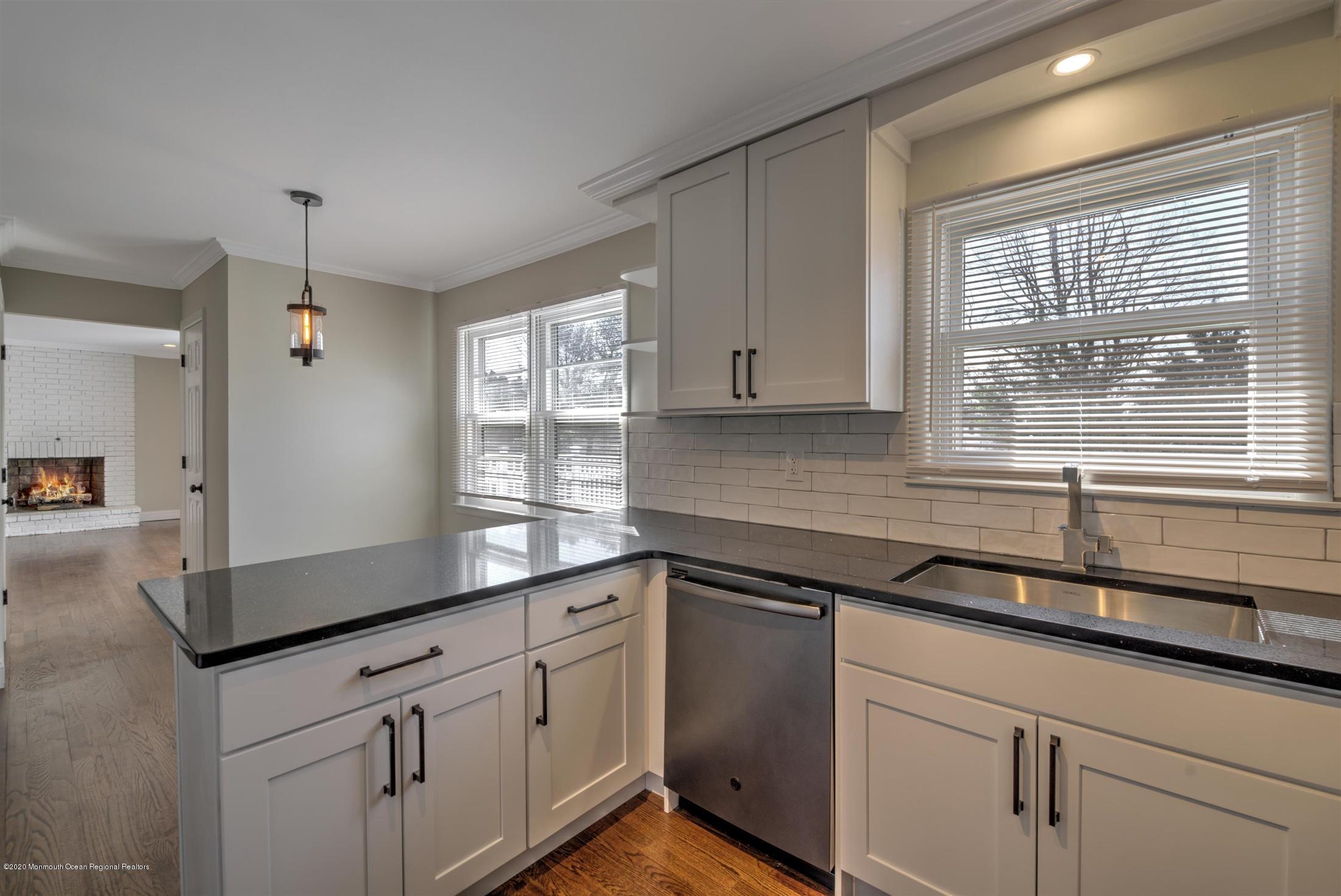 518 East Freehold Road Freehold, NJ 07728 - Photo 7 of 35 a kitchen with granite countertop cabinets stainless steel appliances a sink and a window