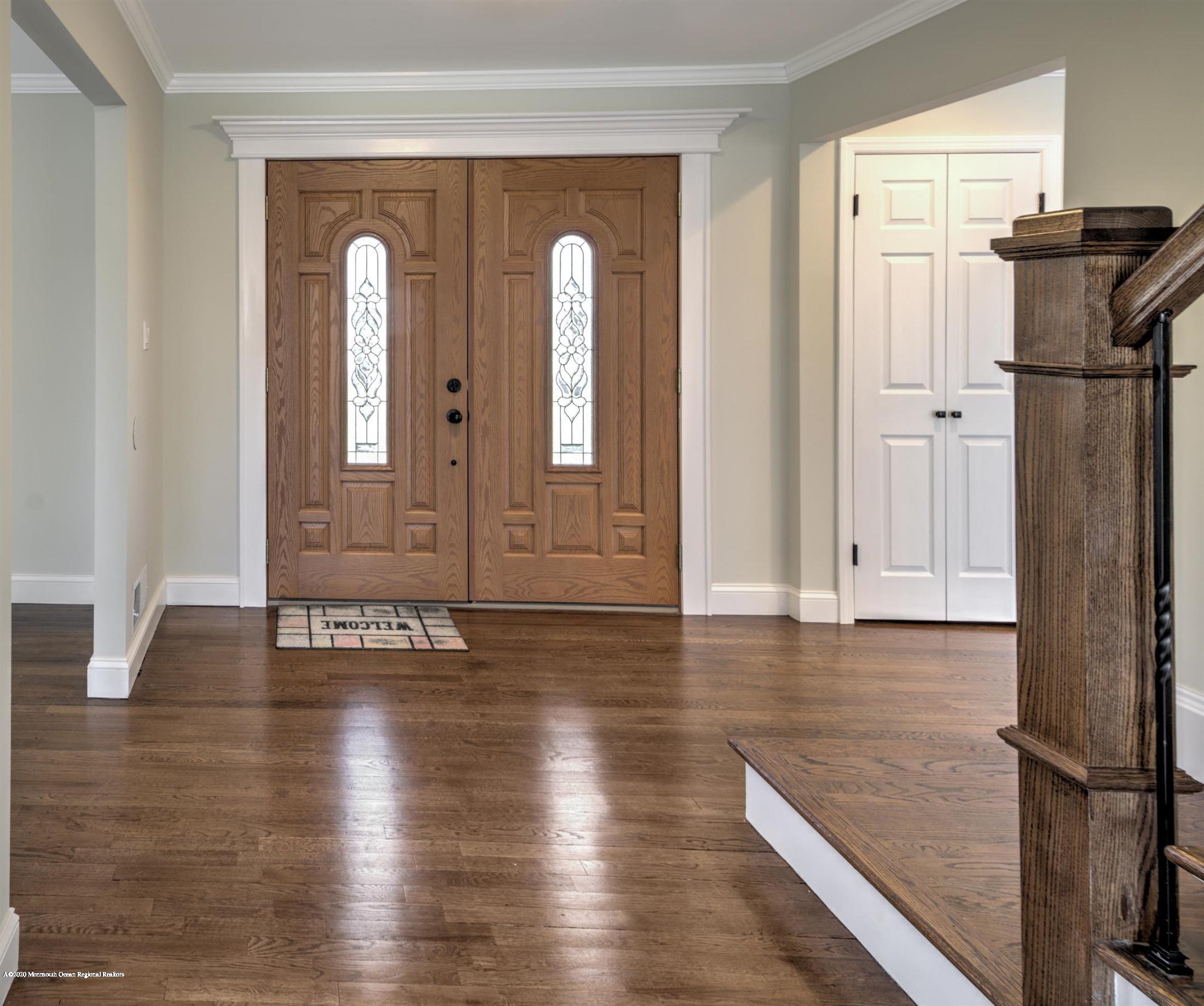 518 East Freehold Road Freehold, NJ 07728 - Photo 9 of 35 a view of livingroom with hardwood floor and hallway