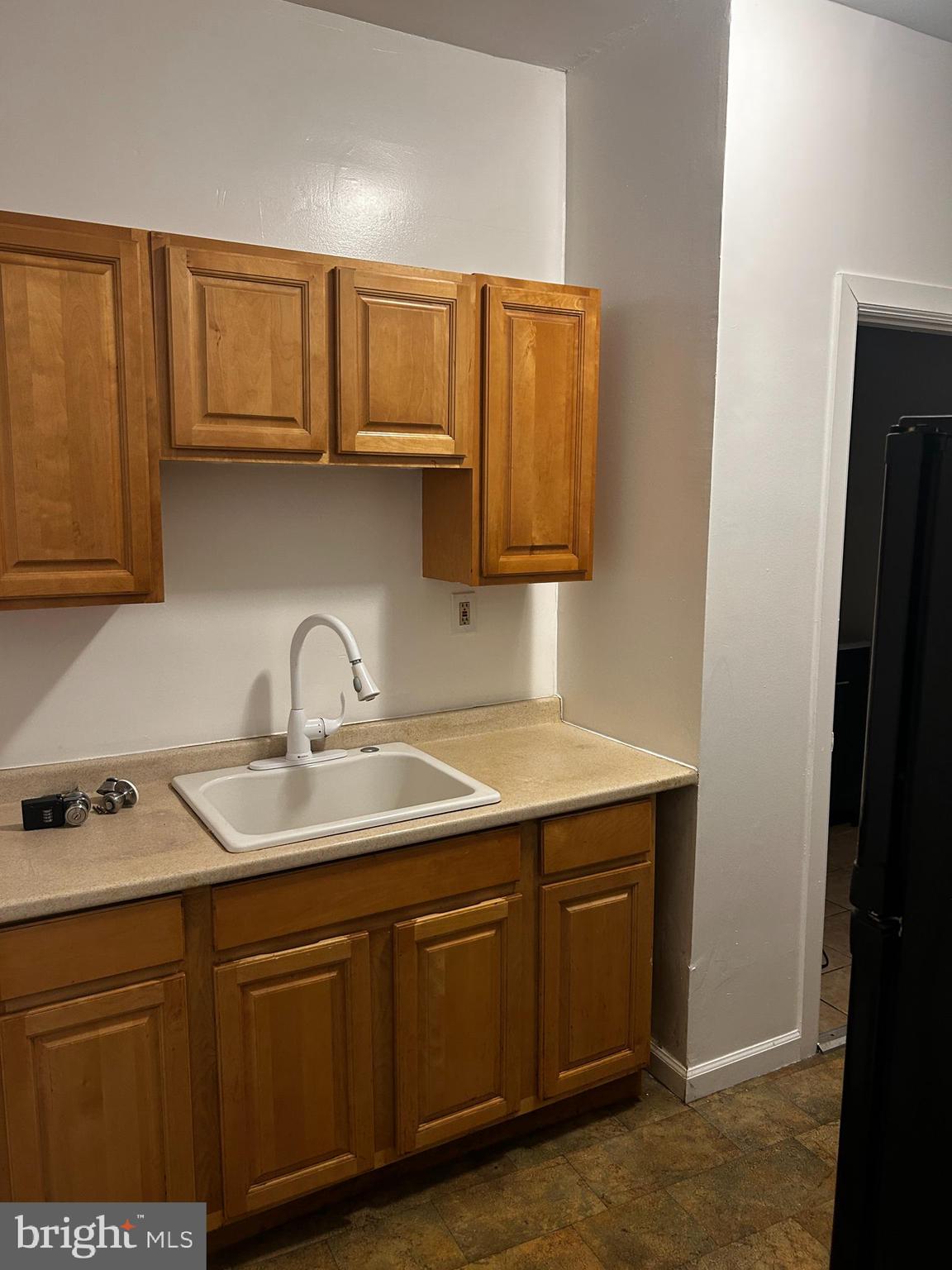 29 North Main Street, Unit 2F Spring City, PA 19475 - Photo 7 of 10 a kitchen with stainless steel appliances granite countertop a sink and cabinets