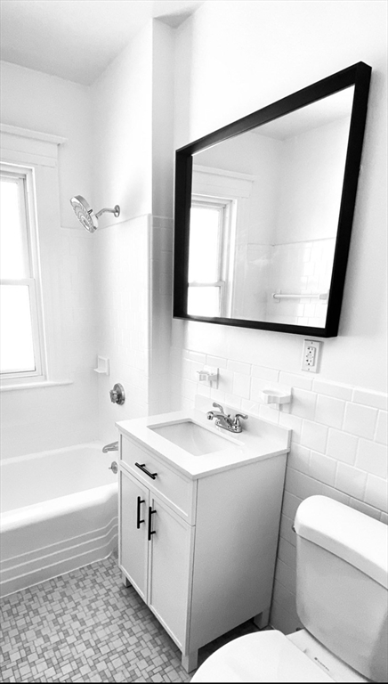 14 Welton Road Boston, MA 02132 - Photo 26 of 31 a bathroom with a toilet a sink and a bathtub