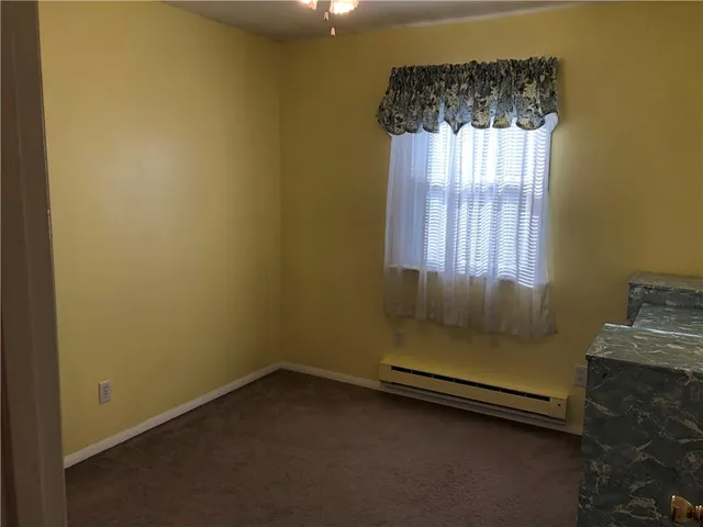 a room with a bed and a window