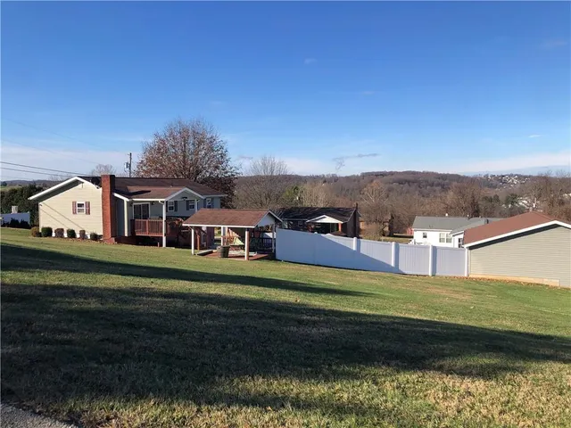 a view of a house with a big yard