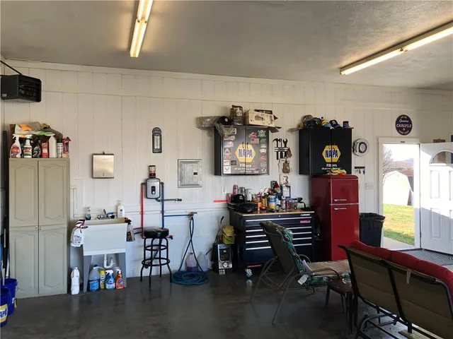 a view of a livingroom with furniture wooden floor and a window