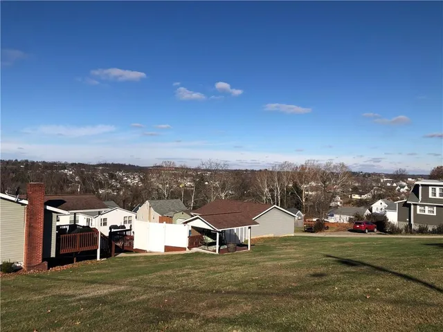 a view of residential houses with outdoor space