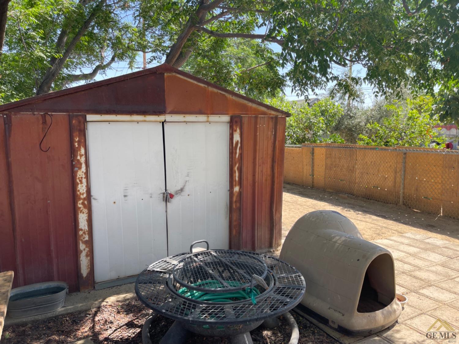 Undisclosed Address Taft, CA 93268 - Photo 14 of 17 a backyard of a house with table and chairs