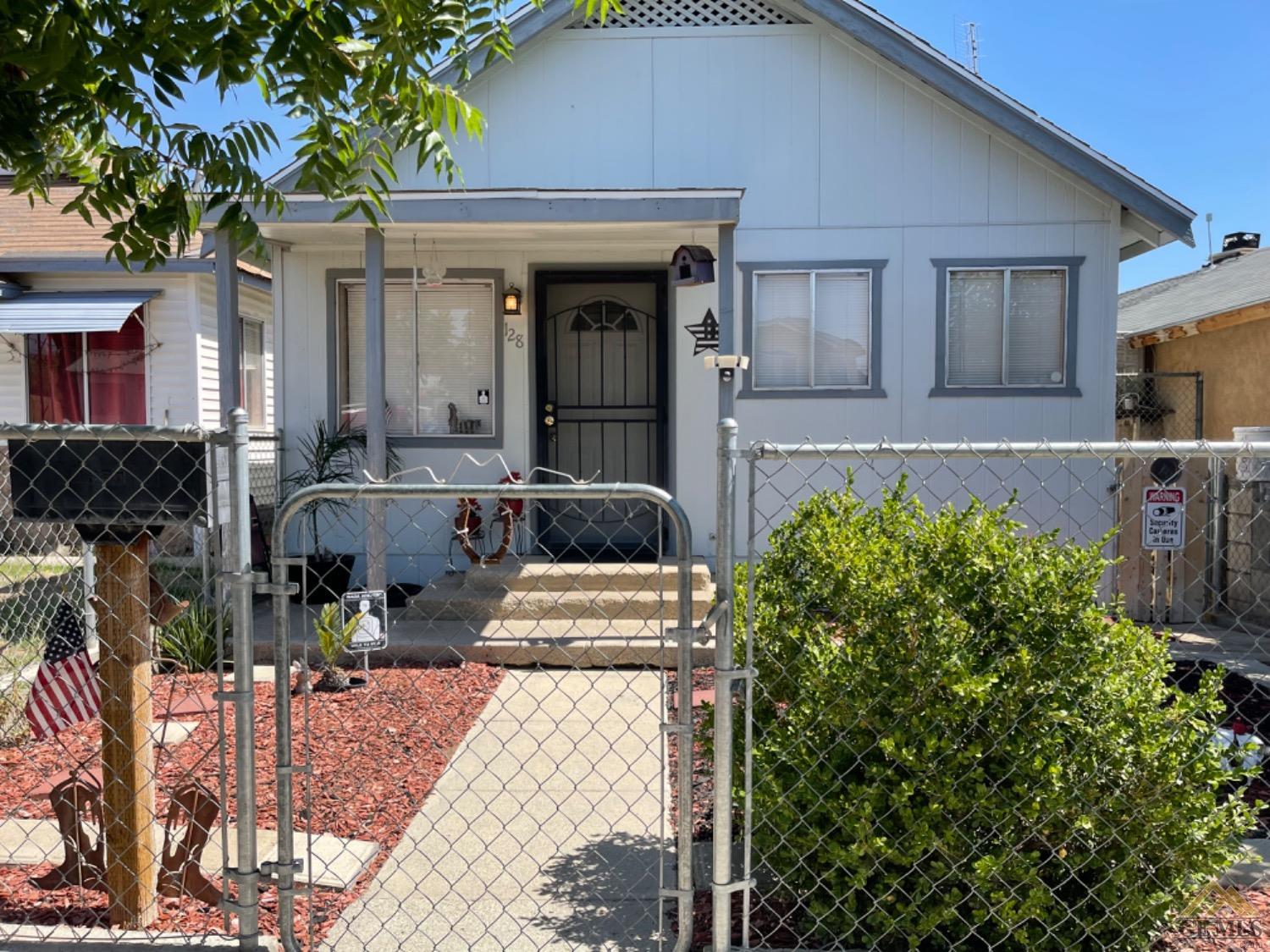 Undisclosed Address Taft, CA 93268 - Photo 5 of 17 a front view of a house with garden