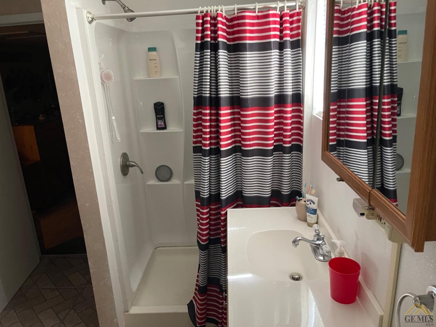 Undisclosed Address Taft, CA 93268 - Photo 9 of 17 a bathroom with a bathtub and shower