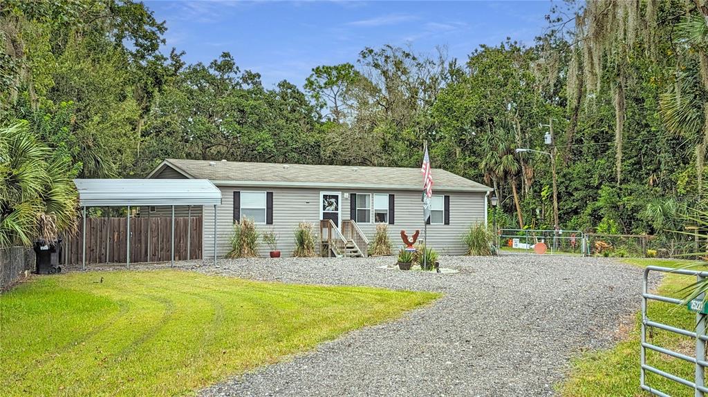 25212 Luke Street Christmas, FL 32709 - Photo 22 of 26 a front view of a house with a yard