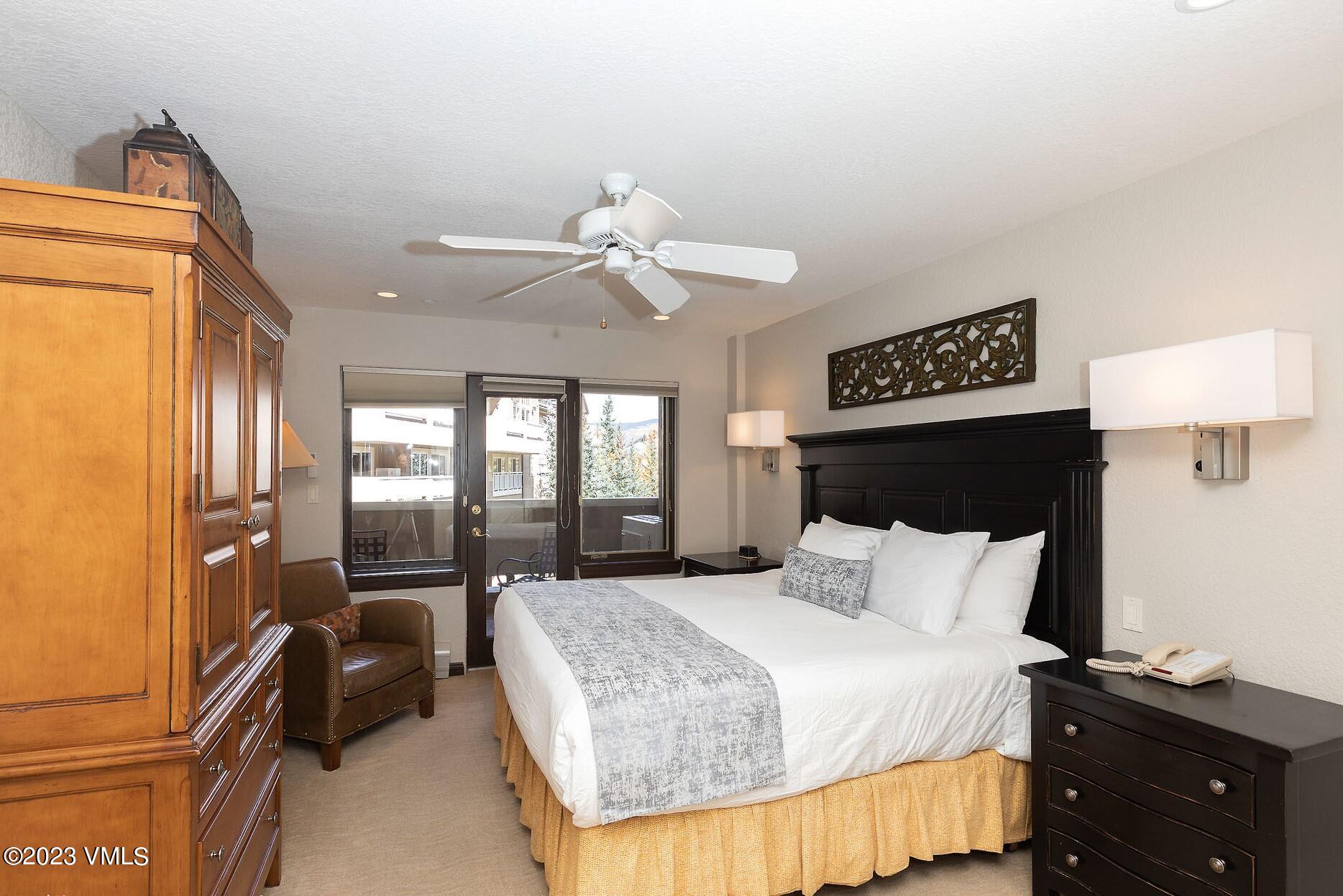 210 Offerson Road, Unit 312 WEEK 48 Beaver Creek, CO 81620 - Photo 12 of 23 a bedroom with a bed and dresser with mirror