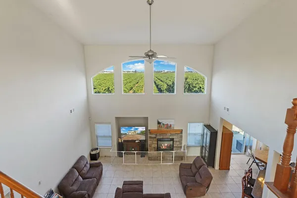 a dining room with furniture and a chandelier