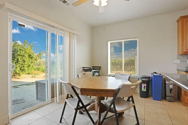 a dining room with furniture and window