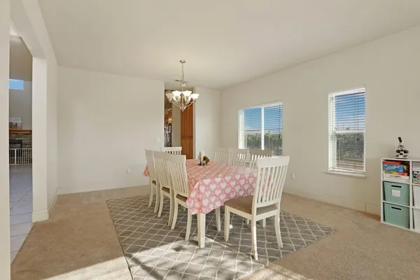 a view of a dining room with furniture