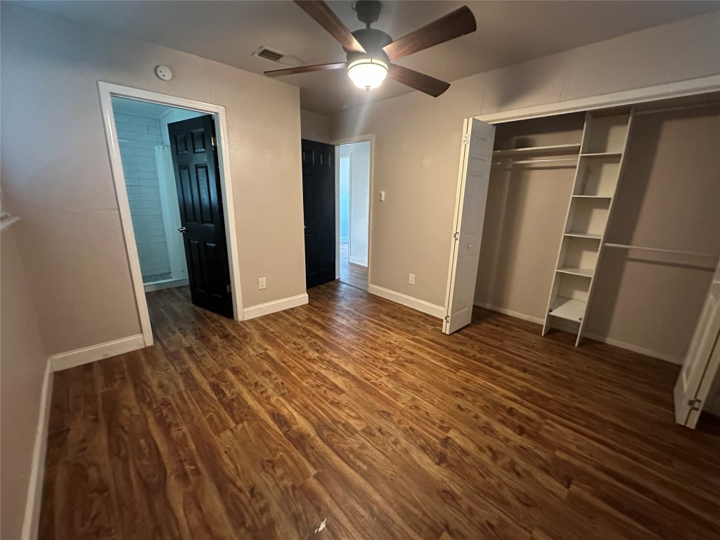 6004 Palm Circle Austin, TX 78741 - Photo 12 of 27 an empty room with wooden floor and entrance