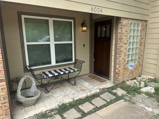 a backyard of a house with seating space