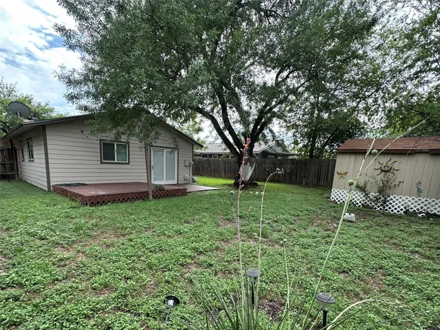a backyard of a house with lots of green space