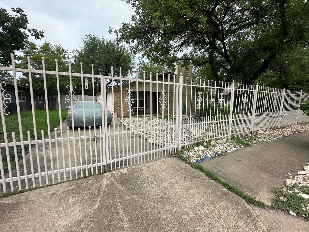6004 Palm Circle Austin, TX 78741 - Photo 5 of 27 a view of a gate with wooden fence