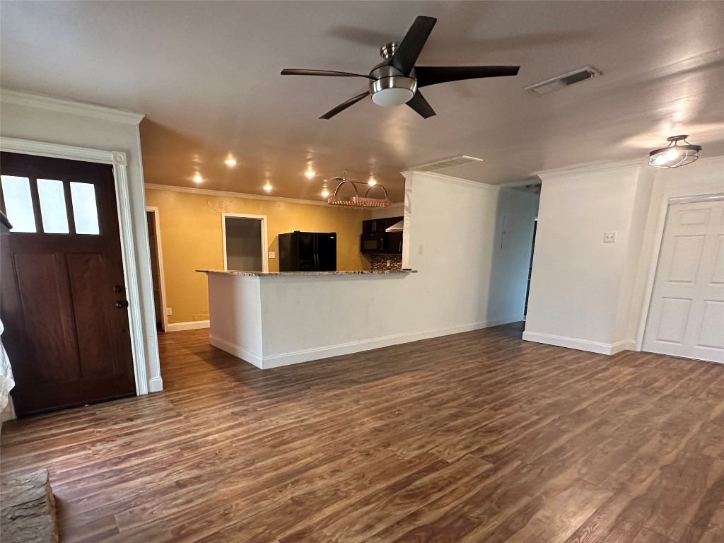 6004 Palm Circle Austin, TX 78741 - Photo 27 of 27 a view of a livingroom with a stove and kitchen floors
