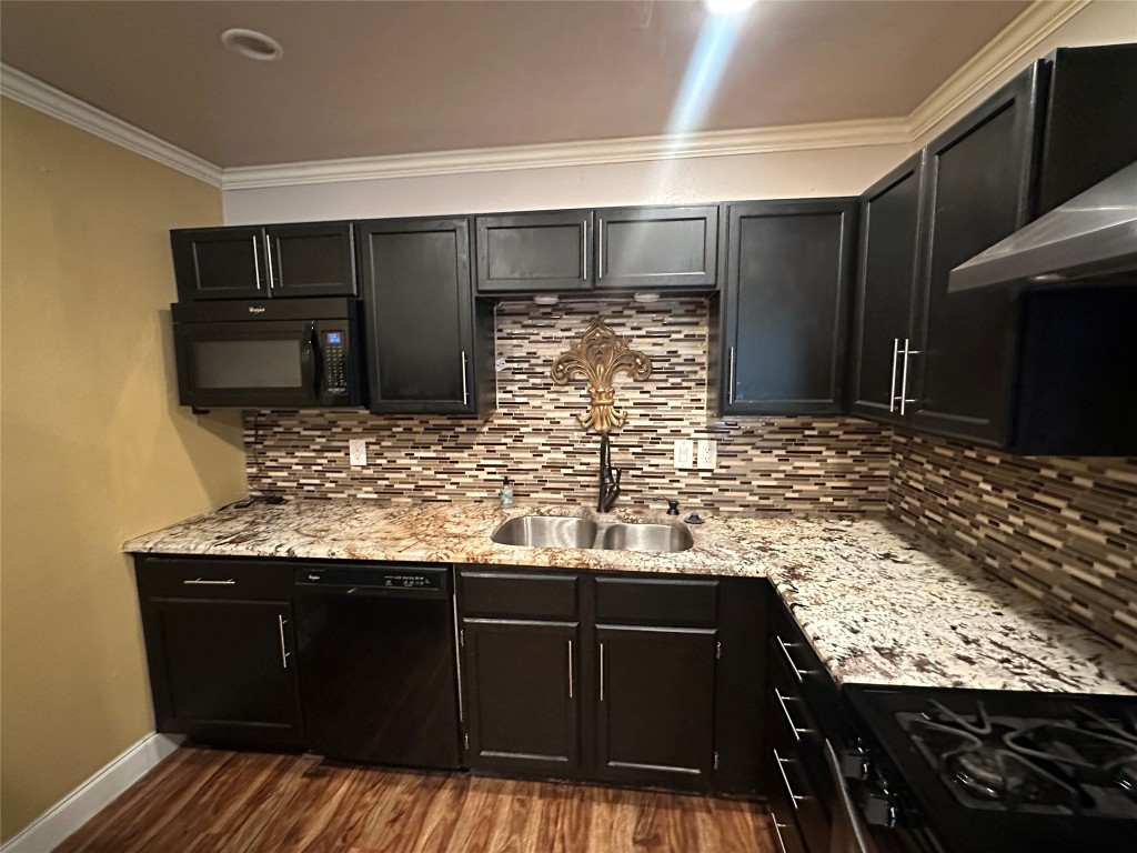 6004 Palm Circle Austin, TX 78741 - Photo 8 of 27 a bathroom with a granite countertop sink and a mirror