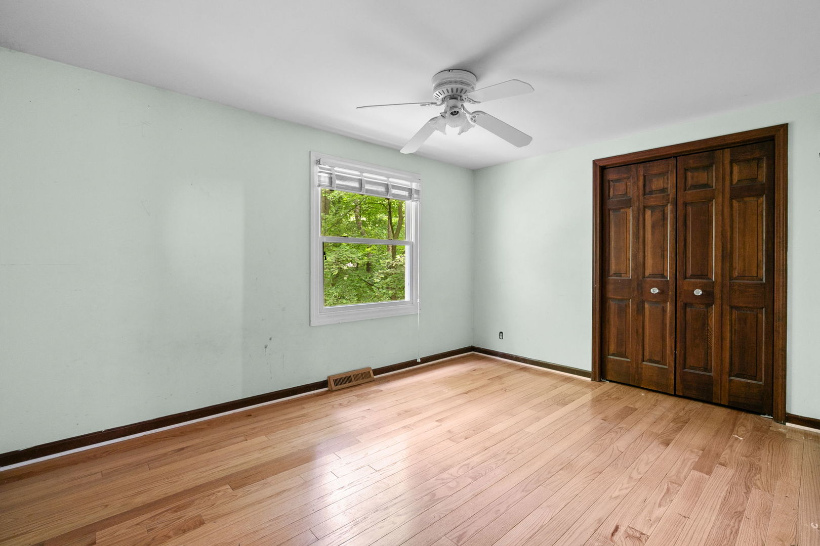 36W525 Wild Rose Road St. Charles, IL 60174 - Photo 24 of 39 a view of an empty room with wooden floor and a window