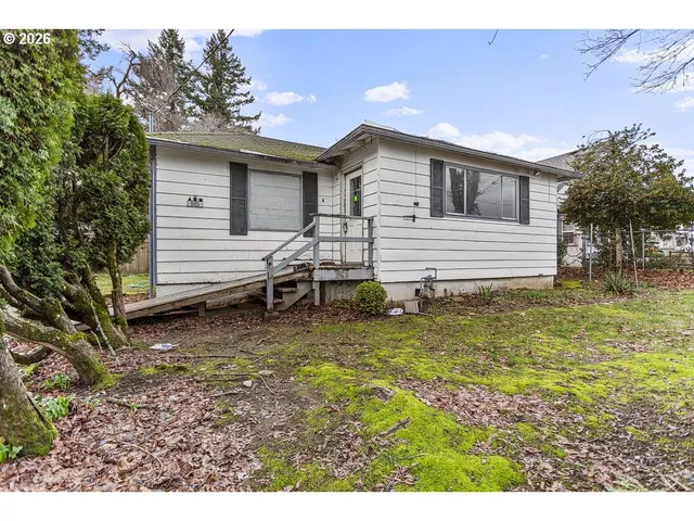 a view of a house with a street