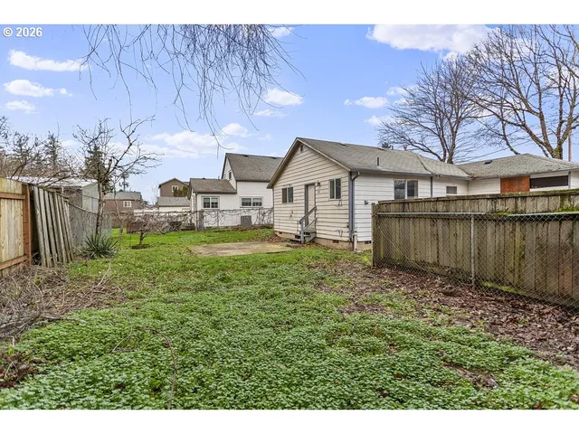a backyard of a house with lots of green space