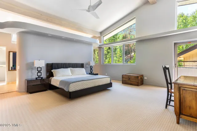 a bedroom with furniture and a window