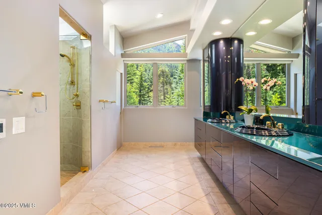 a view of hallway with furniture and a large window
