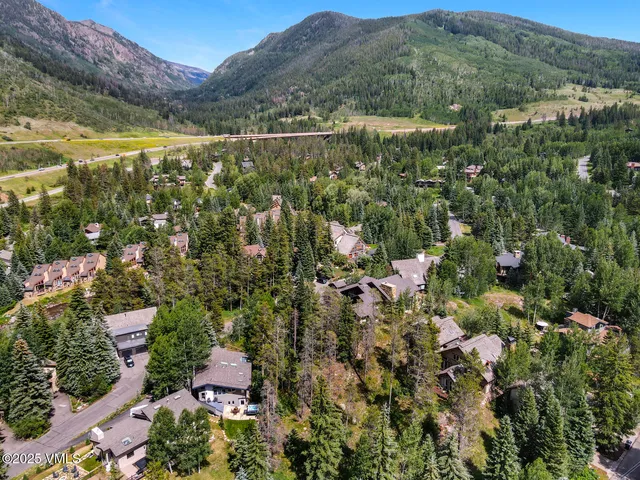 a view of a city with mountains in the background