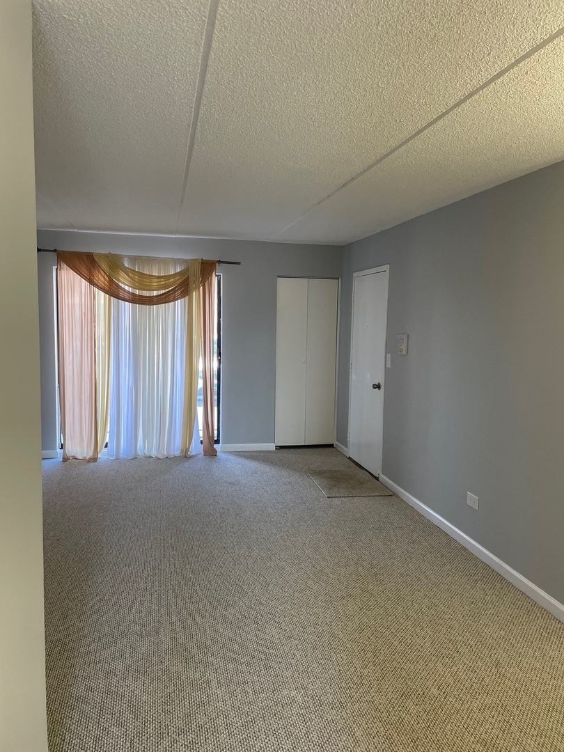 5500 Tinder, Unit 2 Rolling Meadows, IL 60008 - Photo 7 of 14 a view of an empty room and window