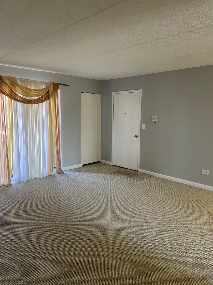 5500 Tinder, Unit 2 Rolling Meadows, IL 60008 - Photo 9 of 14 a view of an empty room with a window
