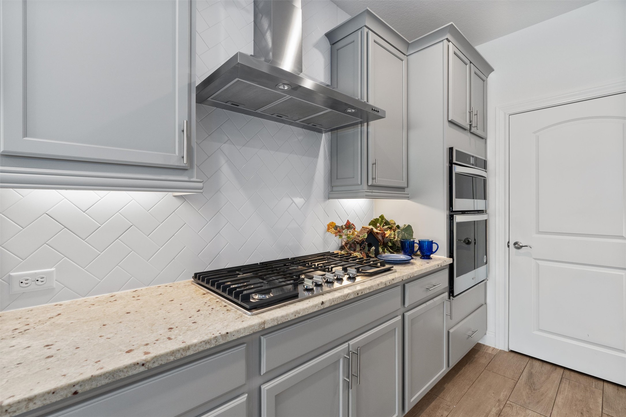 202 Spanish Star Street Georgetown, TX 78633 - Photo 12 of 32 a kitchen with stainless steel appliances granite countertop a sink stove and cabinets