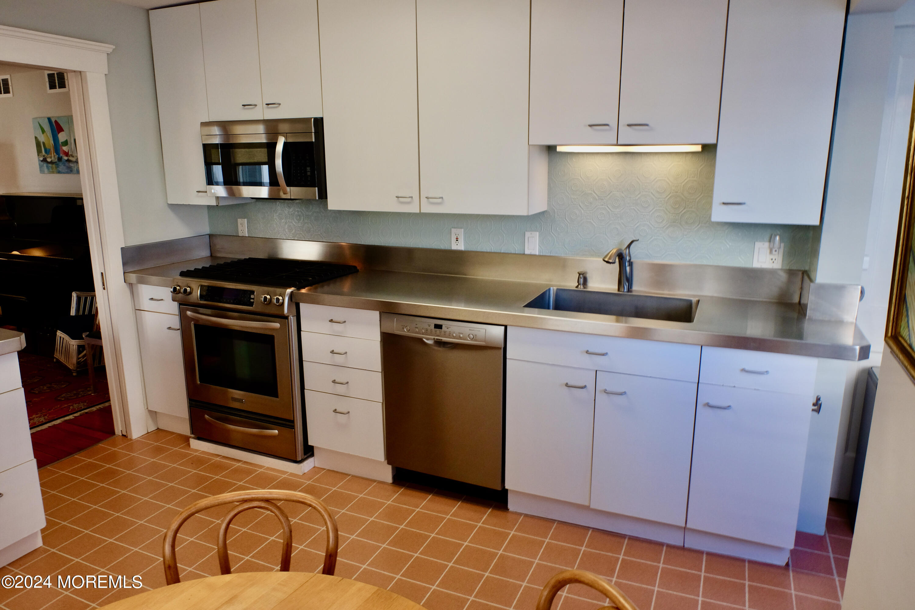 220 Lincoln Avenue, Unit 1 Avon-by-the-Sea, NJ 07717 - Photo 13 of 26 a kitchen with a stove and a sink