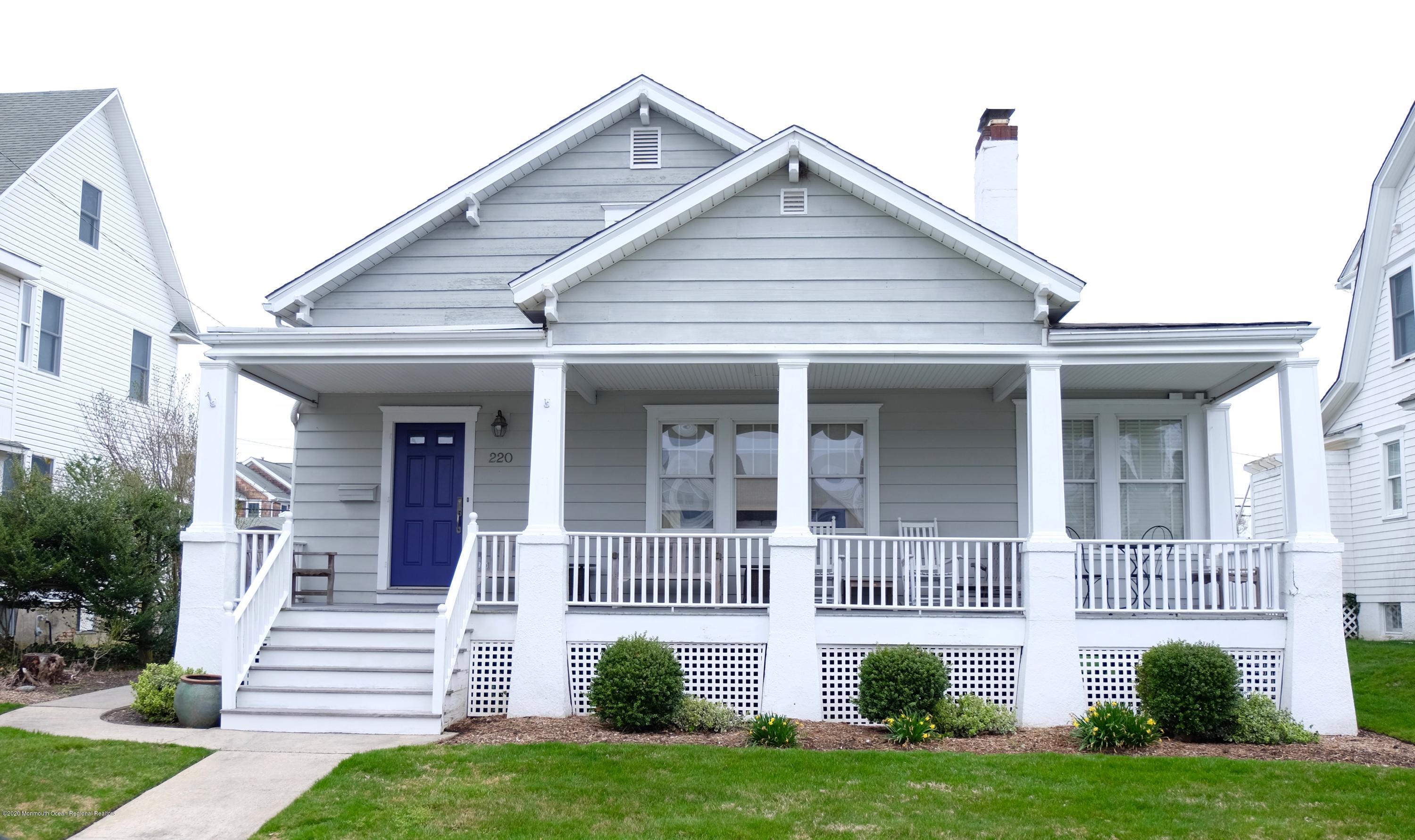 220 Lincoln Avenue, Unit 1 Avon-by-the-Sea, NJ 07717 - Photo 24 of 26 a front view of a house with a yard