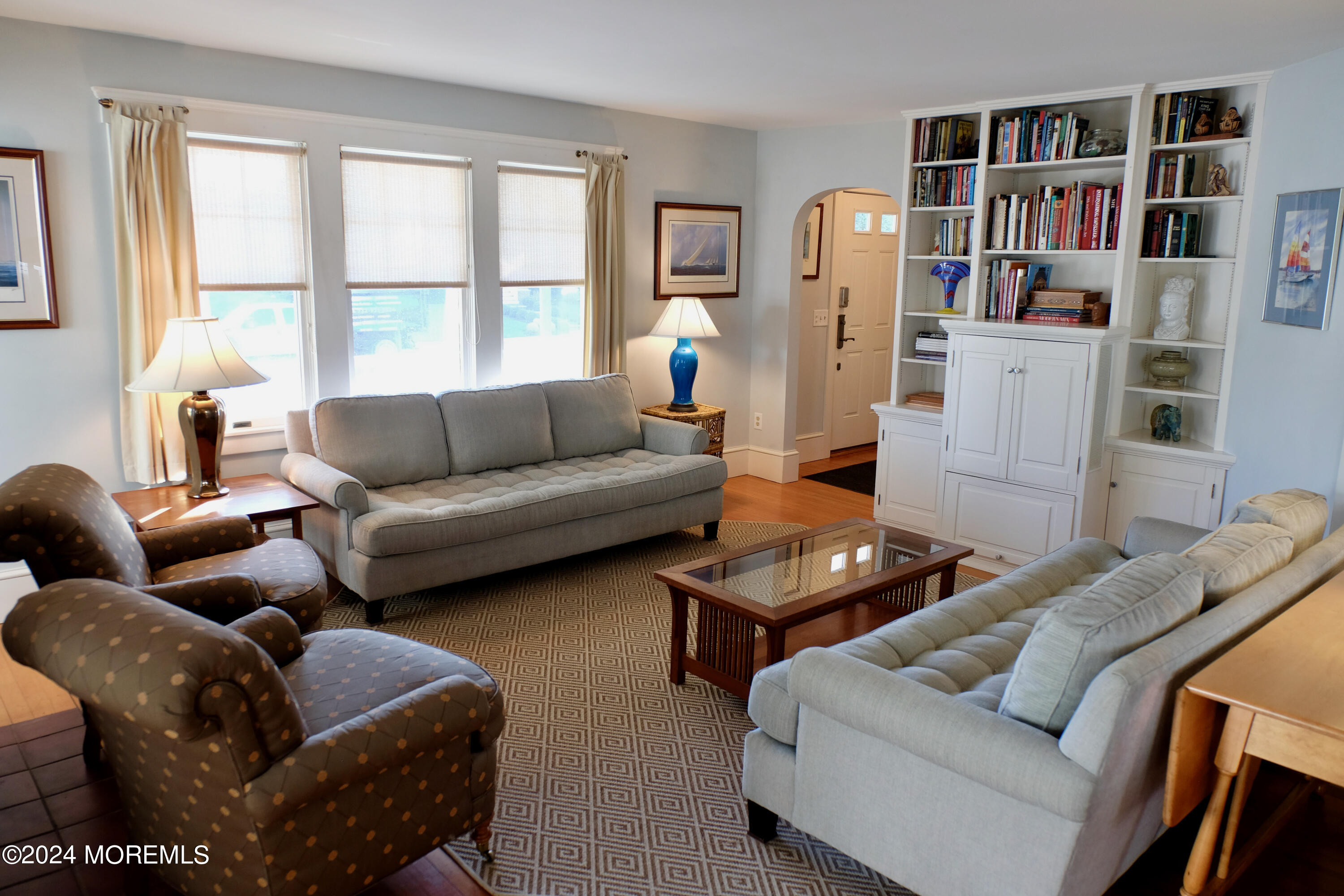 220 Lincoln Avenue, Unit 1 Avon-by-the-Sea, NJ 07717 - Photo 3 of 26 a living room with furniture and a window