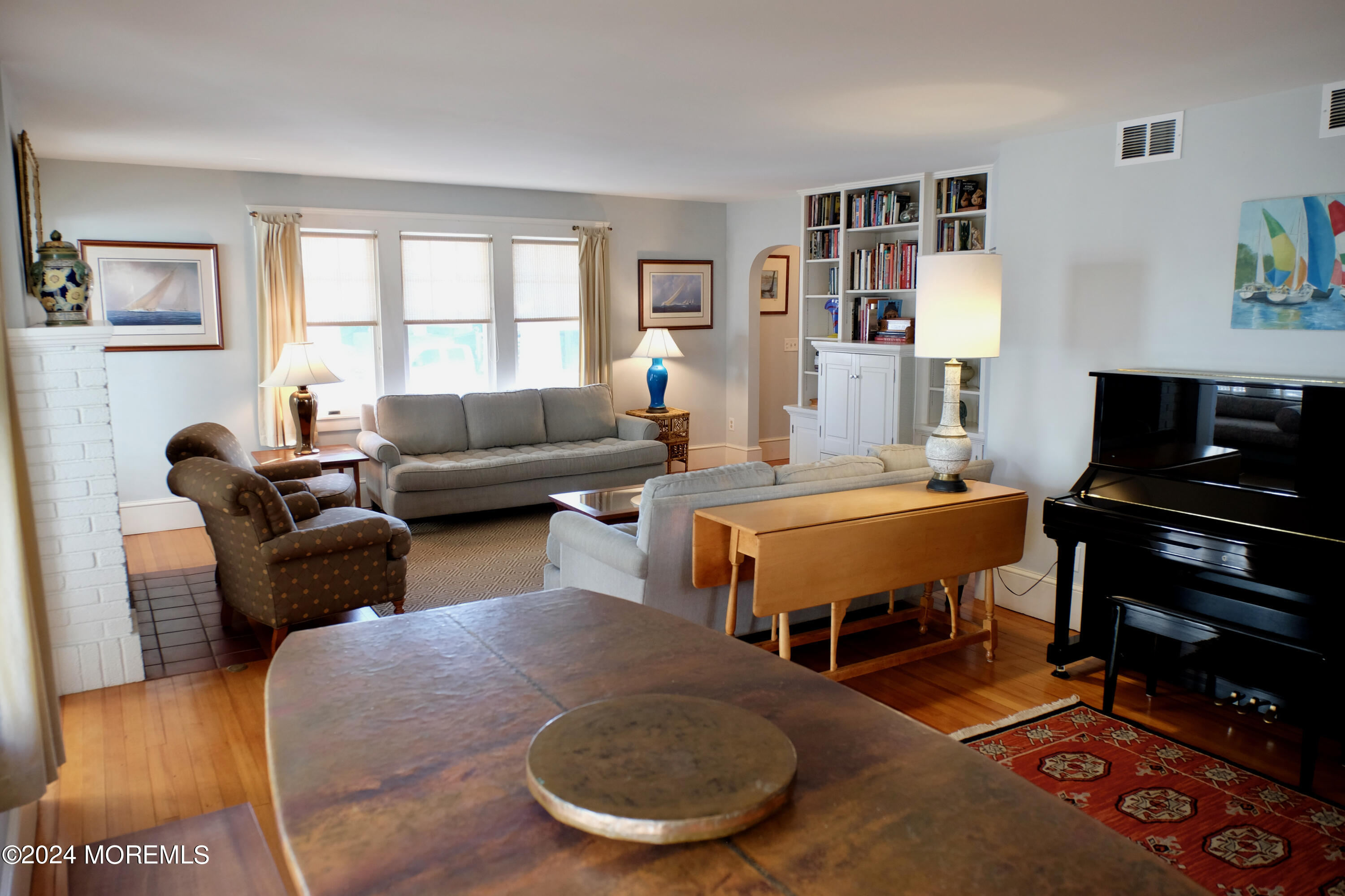220 Lincoln Avenue, Unit 1 Avon-by-the-Sea, NJ 07717 - Photo 6 of 26 a living room with furniture a rug and a window
