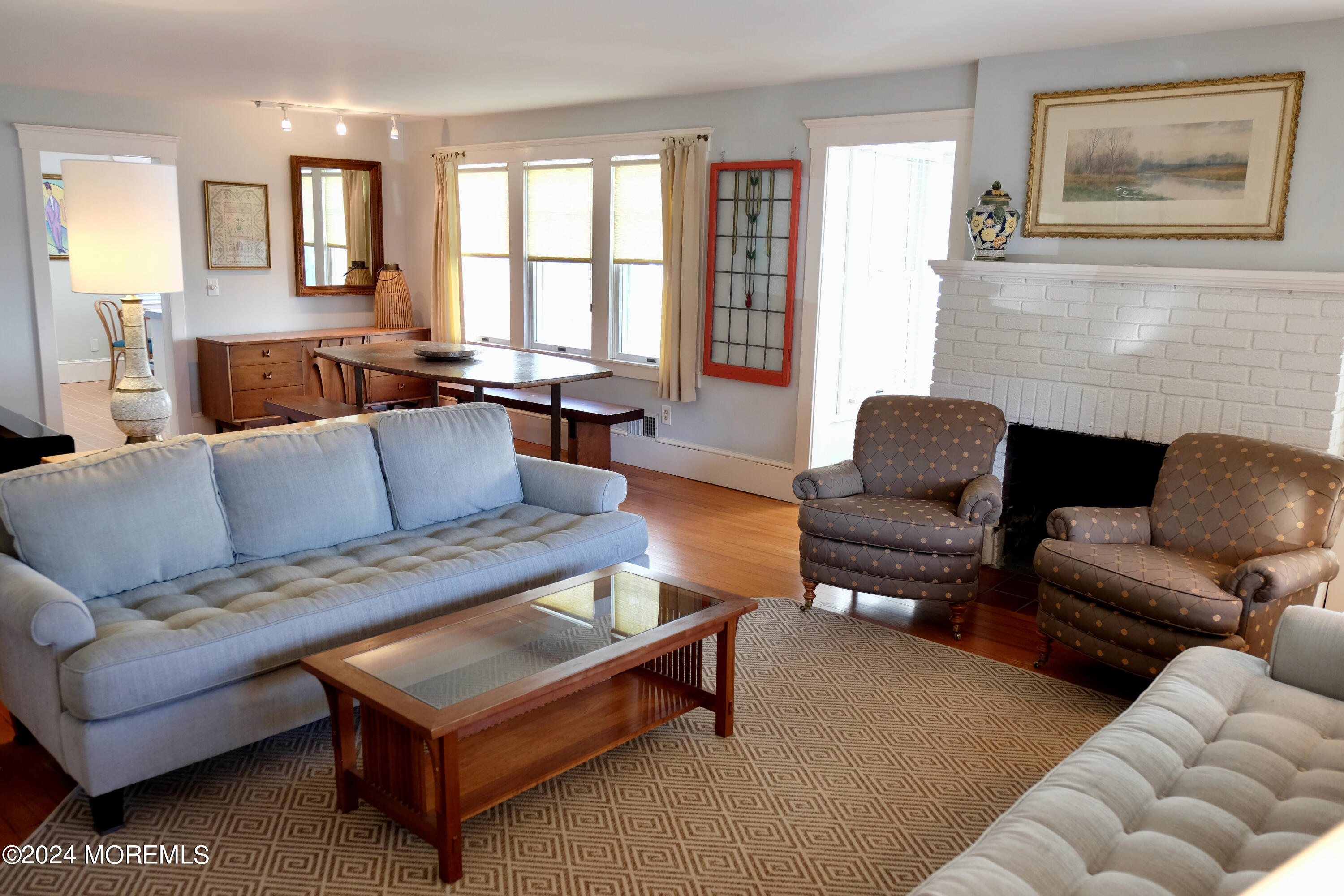 220 Lincoln Avenue, Unit 1 Avon-by-the-Sea, NJ 07717 - Photo 7 of 26 a living room with furniture fireplace and a large window