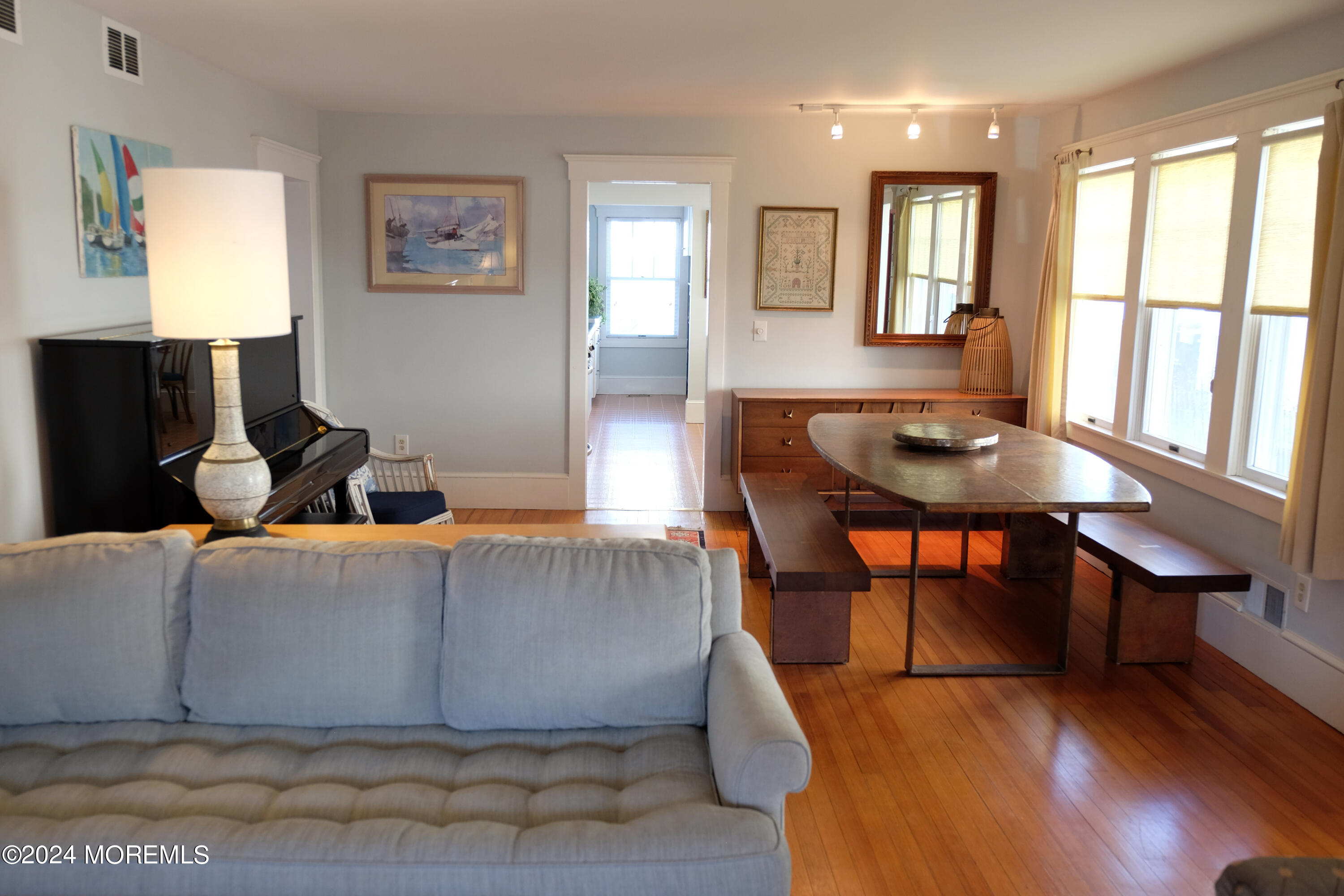 220 Lincoln Avenue, Unit 1 Avon-by-the-Sea, NJ 07717 - Photo 8 of 26 a living room with furniture and a window