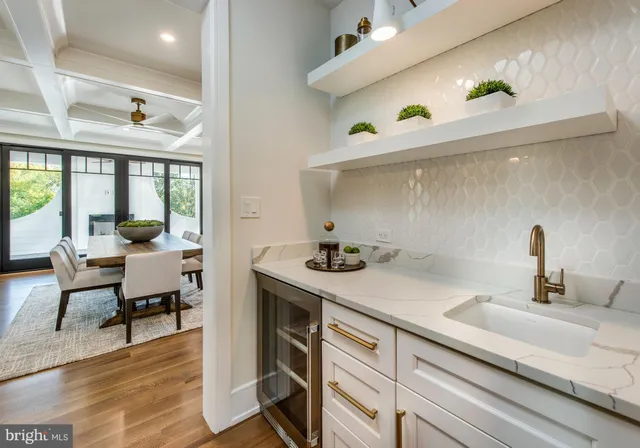 a kitchen with cabinets and wooden floor