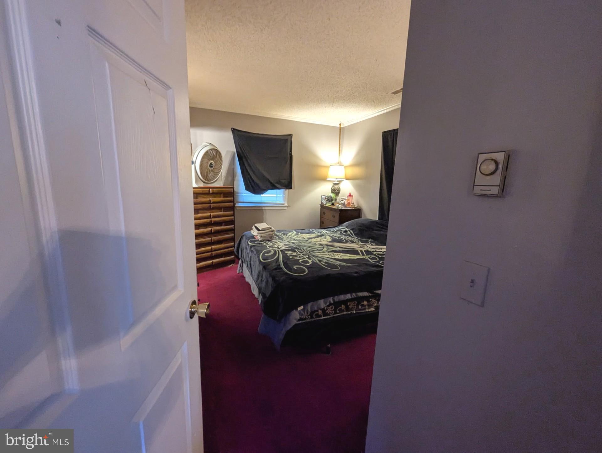 26581 Siloam Road Salisbury, MD 21801 - Photo 11 of 24 a bedroom with a bed and a window