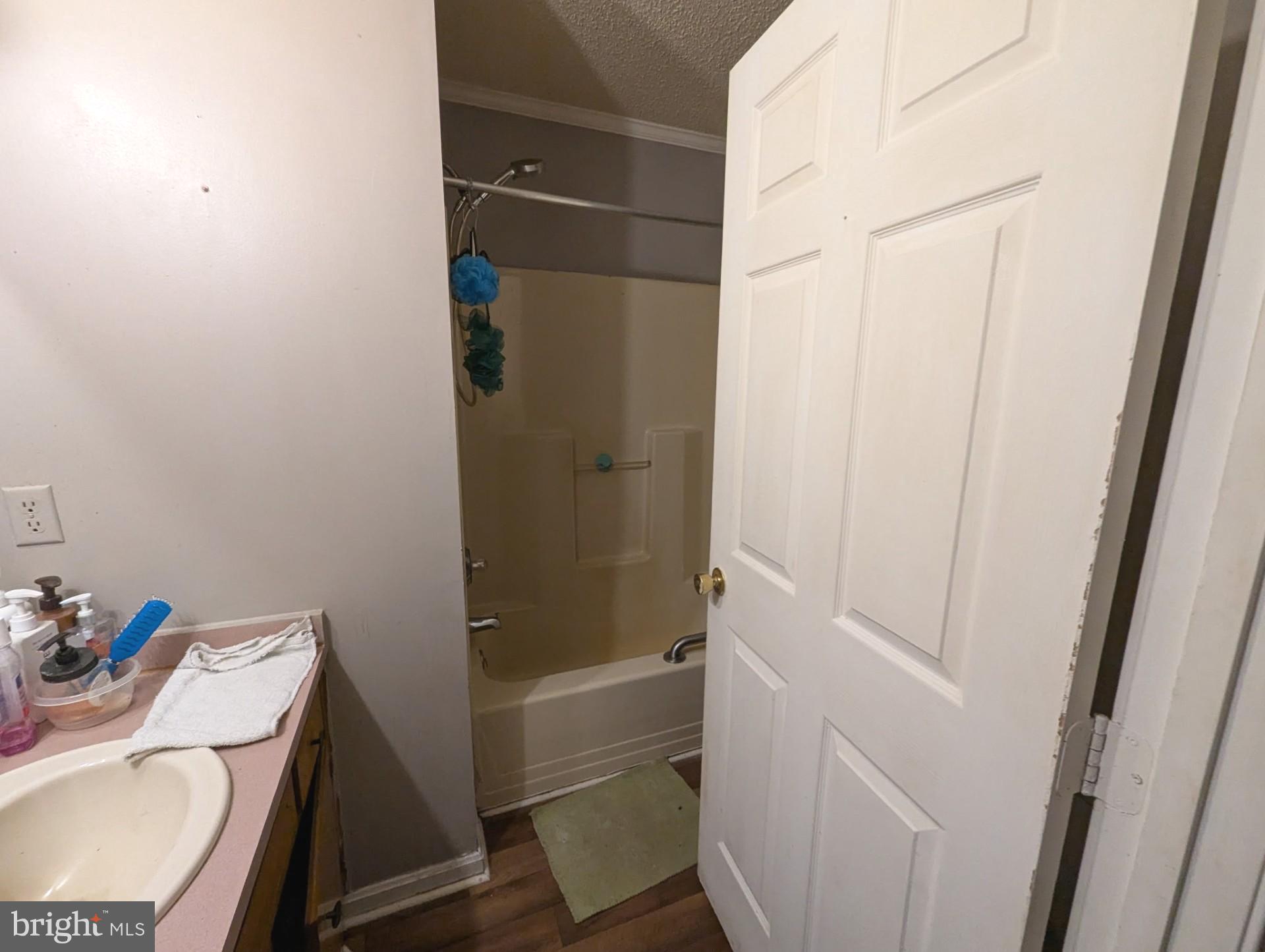 26581 Siloam Road Salisbury, MD 21801 - Photo 20 of 24 a bathroom with a sink toilet and shower
