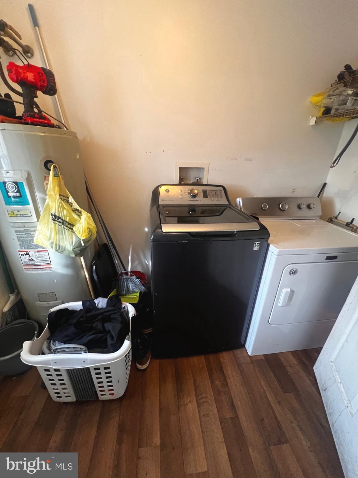 26581 Siloam Road Salisbury, MD 21801 - Photo 21 of 24 a room with water heater and wooden cabinets