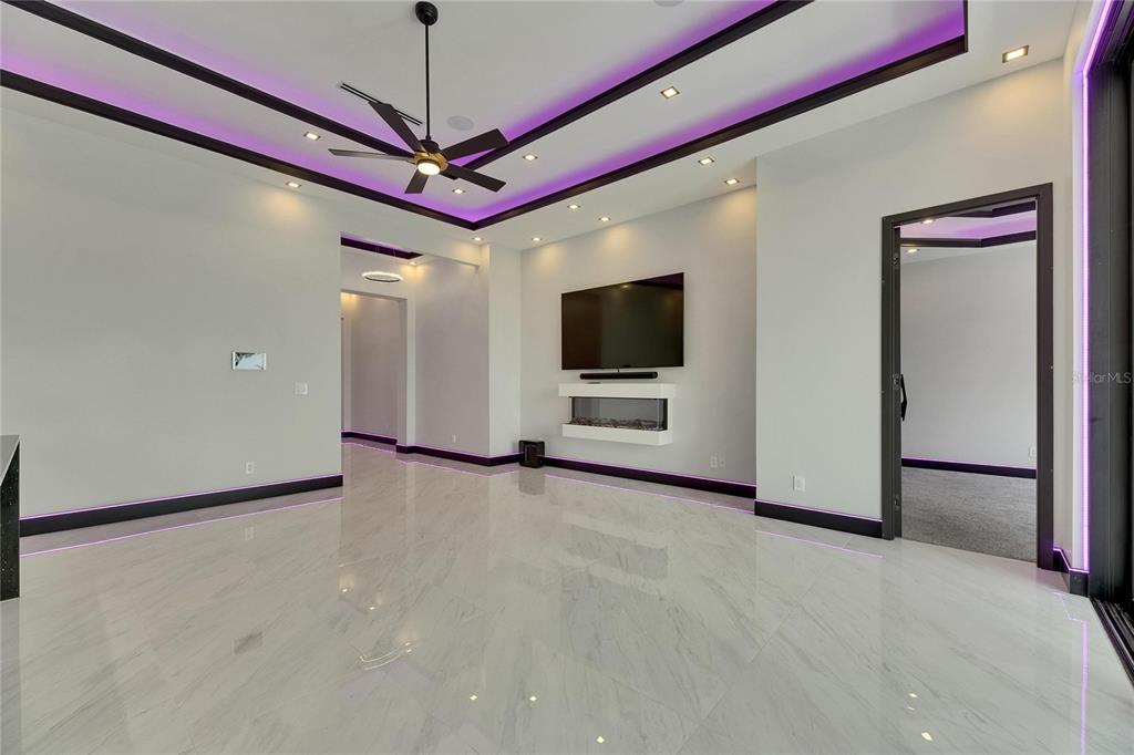 6532 Simone Shores Circle Apollo Beach, FL 33572 - Photo 25 of 86 a view of a livingroom with furniture and a flat screen tv