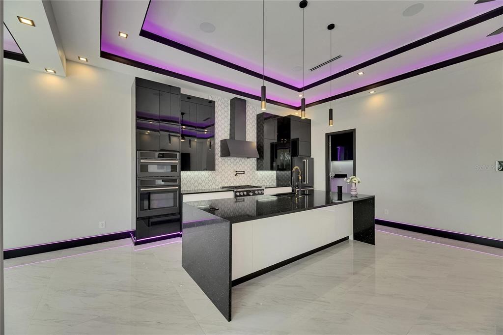 6532 Simone Shores Circle Apollo Beach, FL 33572 - Photo 35 of 86 a living room with furniture and a flat screen tv