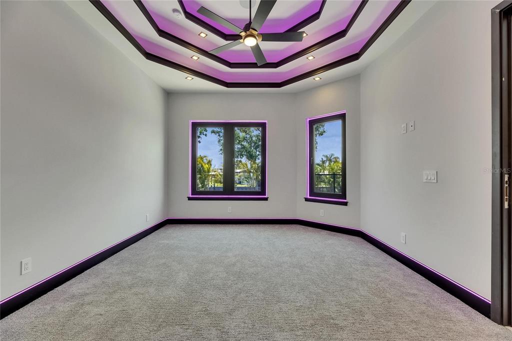 6532 Simone Shores Circle Apollo Beach, FL 33572 - Photo 48 of 86 an empty room with windows and ceiling fan
