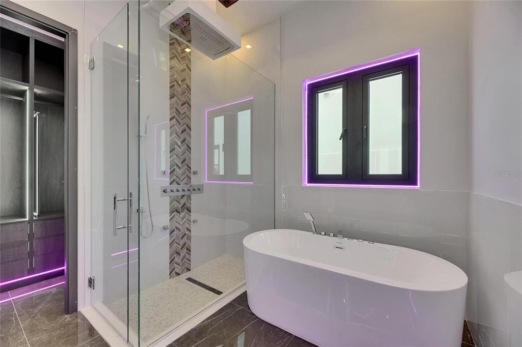 6532 Simone Shores Circle Apollo Beach, FL 33572 - Photo 51 of 86 a white bath tub sitting next to a bathroom