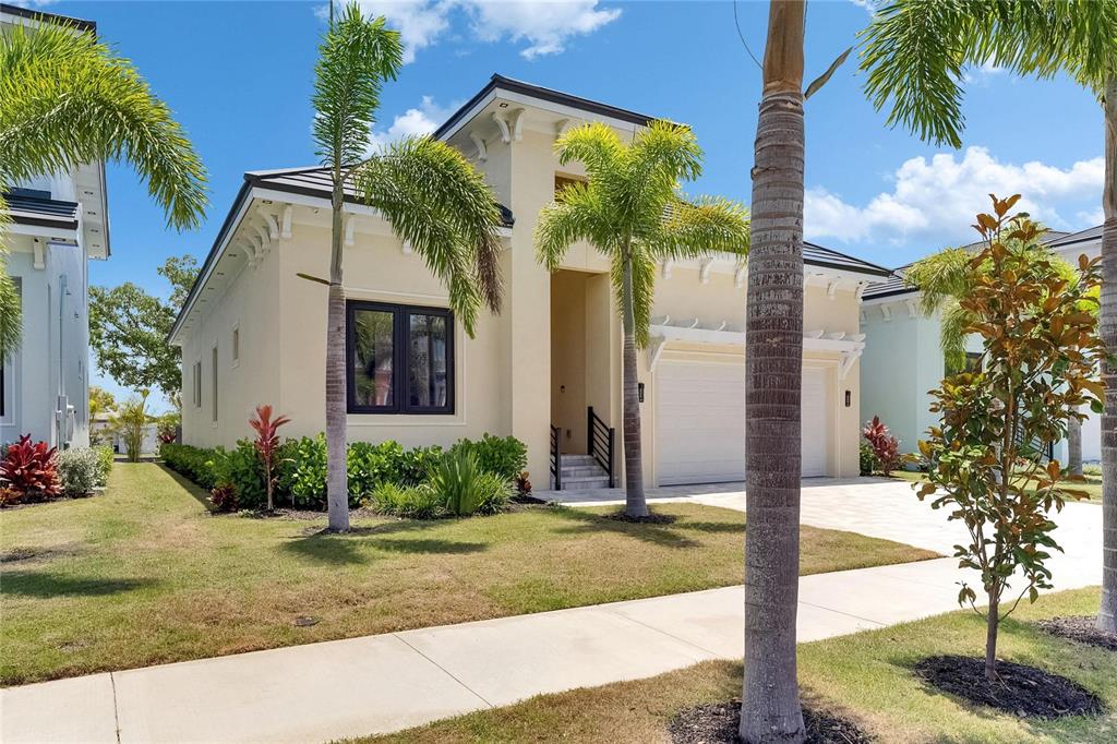 6532 Simone Shores Circle Apollo Beach, FL 33572 - Photo 66 of 86 a front view of a house with garden