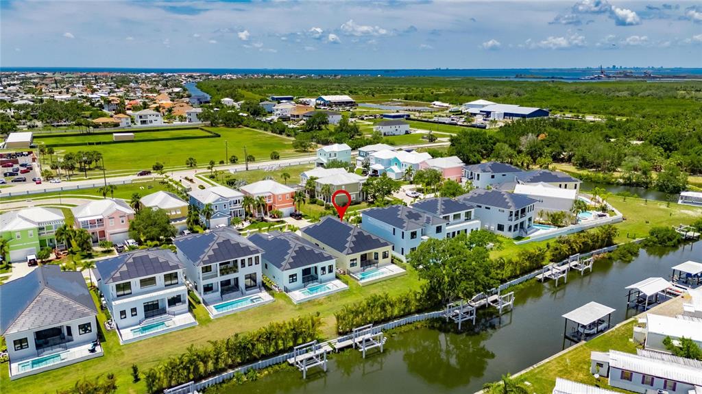 6532 Simone Shores Circle Apollo Beach, FL 33572 - Photo 82 of 86 an aerial view of residential houses with outdoor space and a lake view