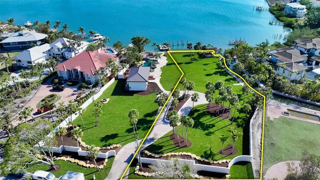 an aerial view of a house with a garden and yard