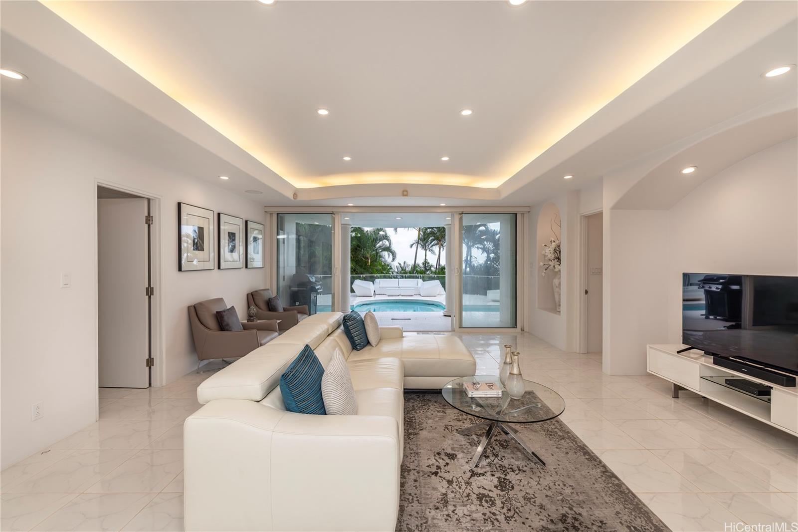 875 Ikena Circle Honolulu, HI 96821 - Photo 12 of 22 a living room with furniture and a flat screen tv