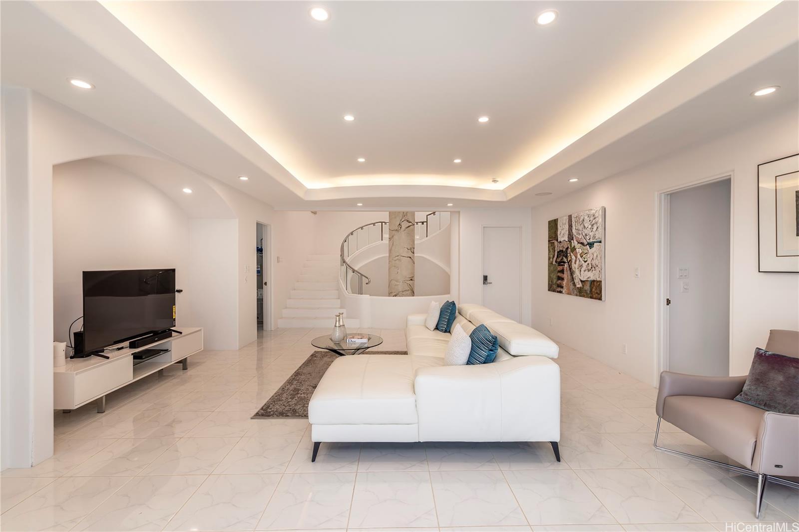 875 Ikena Circle Honolulu, HI 96821 - Photo 13 of 22 a living room with furniture and a flat screen tv